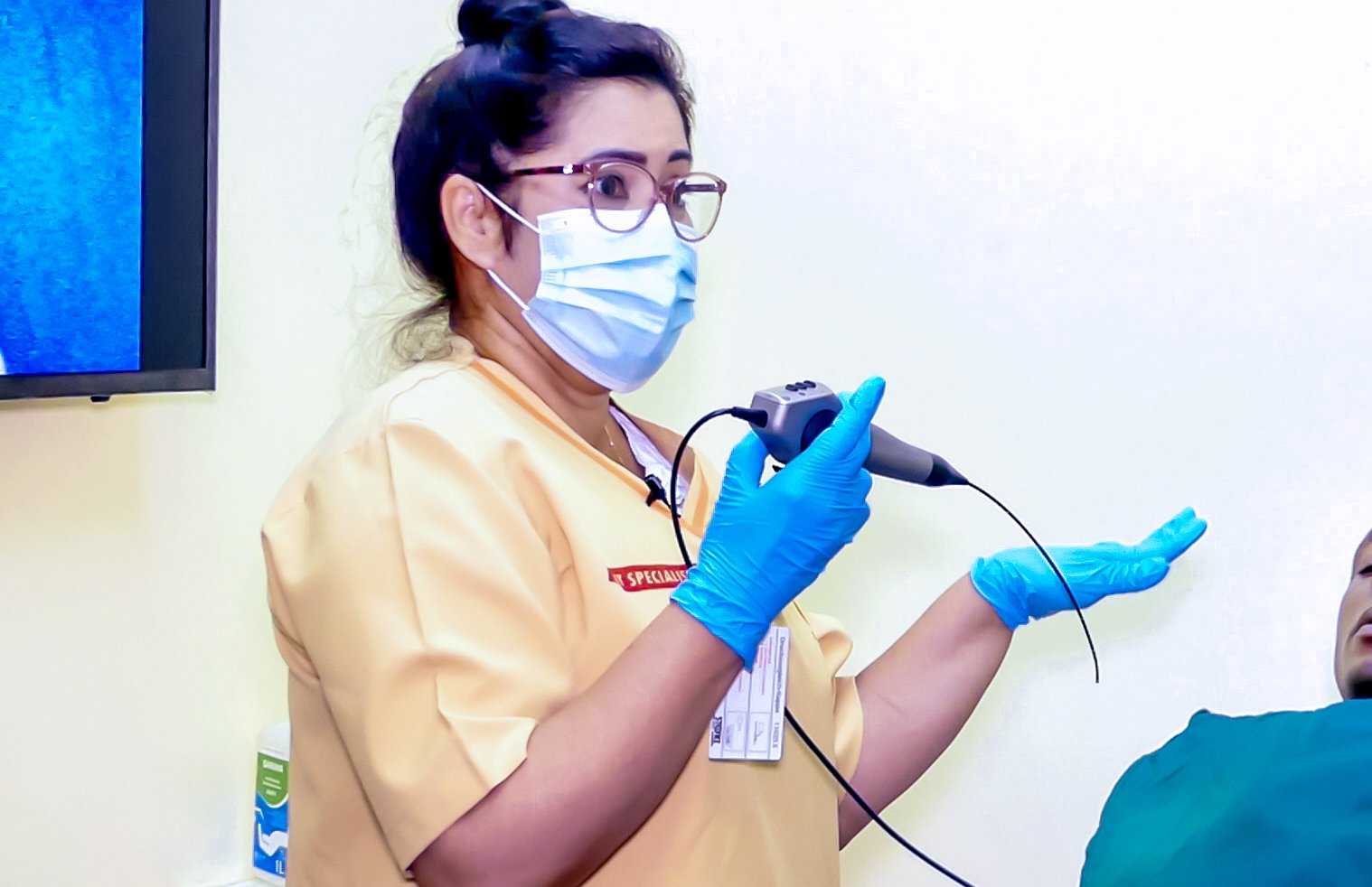 GMS clinician preparing endoscopy equipment for a patient